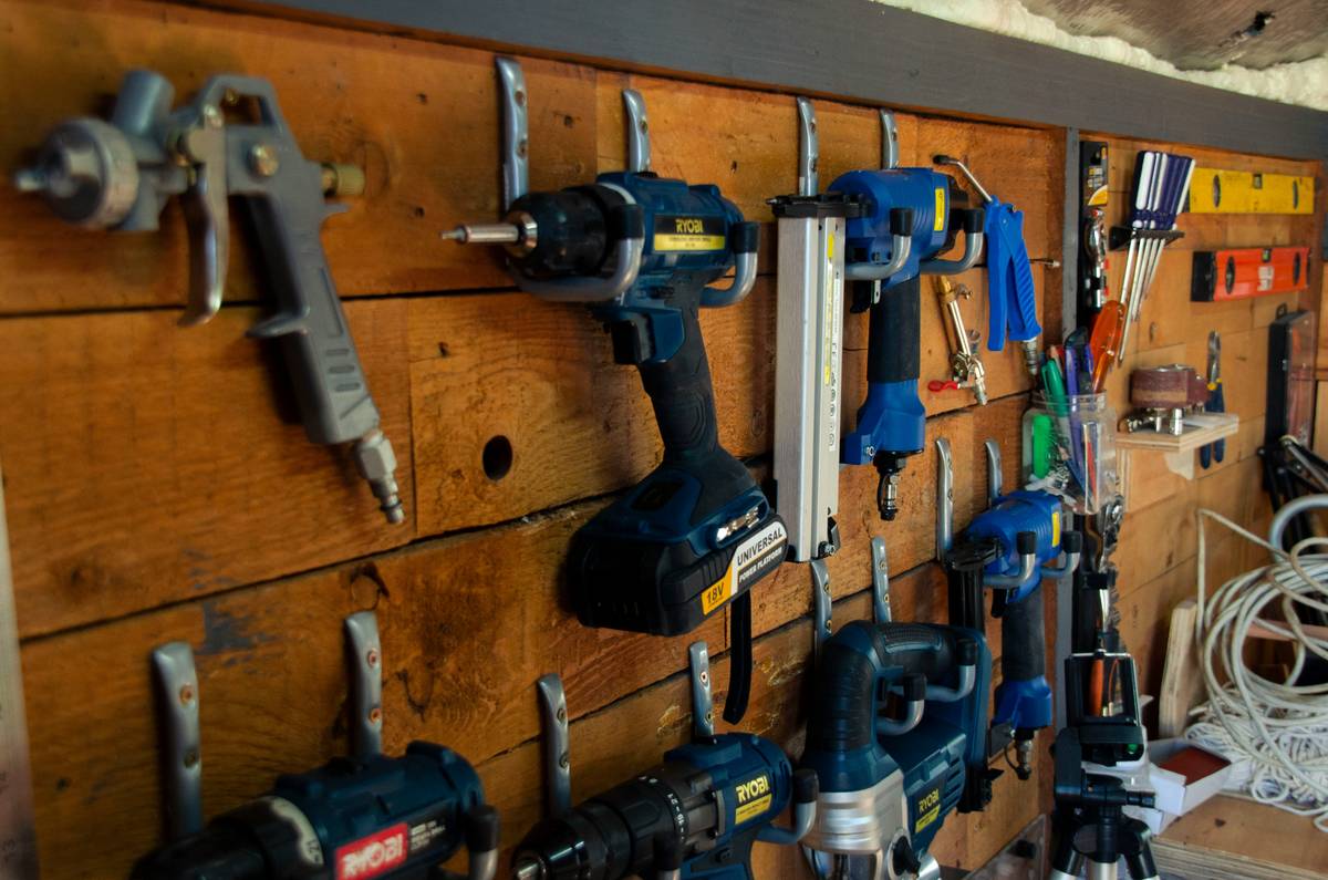 Garage workspace with labeled power strips and organized cords for easy diy power plant setup